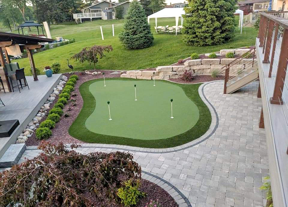 Putting green and patio in backyard of Ohio home